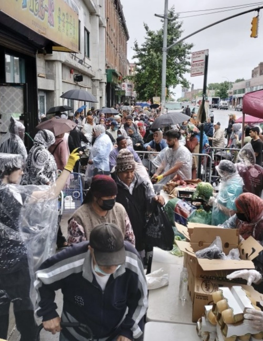 A large group of COPO staff and community members gathered outside in the rain at the city's only Halal food pantry program. A large group of COPO staff and community members gathered outside in the rain at the city's only Halal food pantry program.