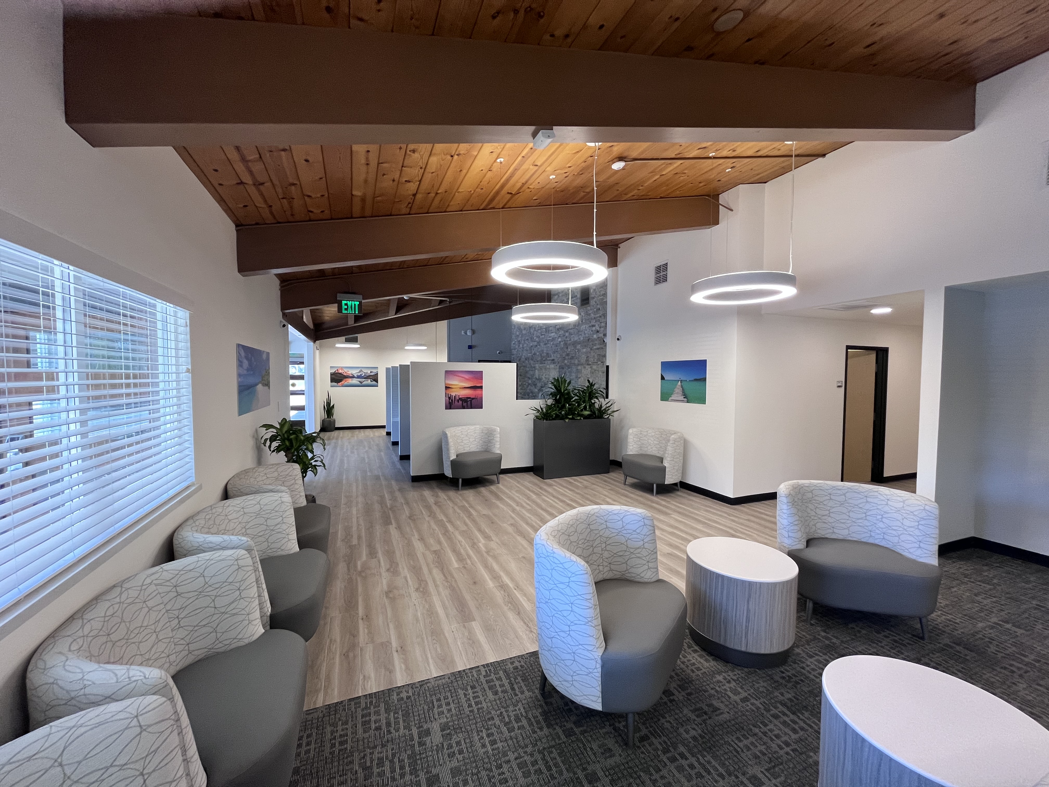 Architect's rendering picturing the lobby of CRMHS' new facility, featuring several comfortable armchairs and round tables Architect's rendering picturing the lobby of CRMHS' new facility, featuring several comfortable armchairs and round tables